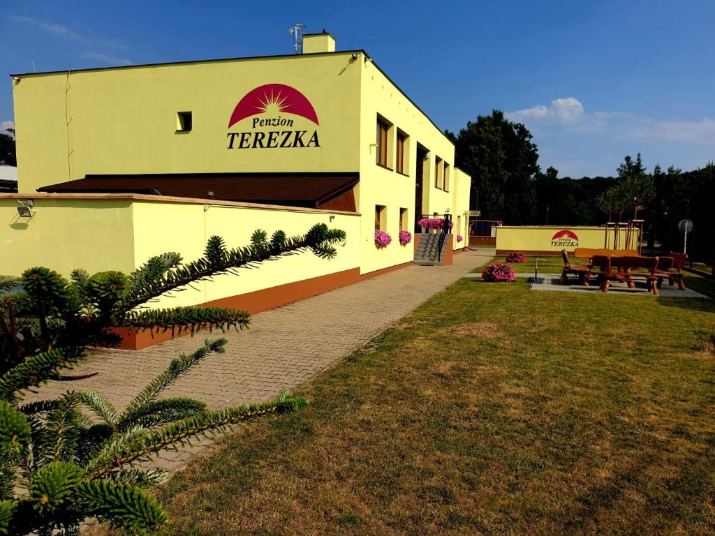 a building with a sign that reads hotel teraza at Penzion Terezka in Hlučín