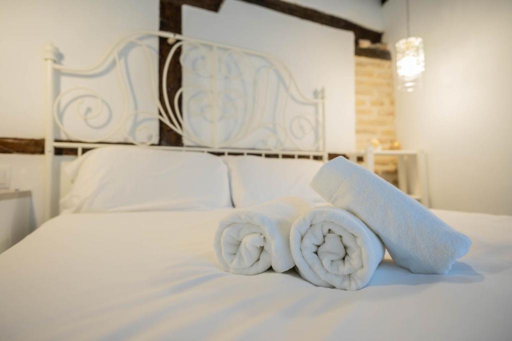 Posteľ alebo postele v izbe v ubytovaní San Cipriano House