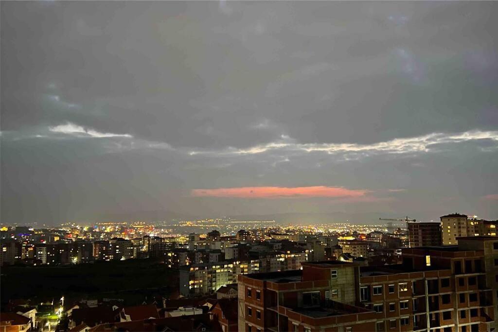 a view of a city at night at Cosy Apartment with a Great View in Pristina