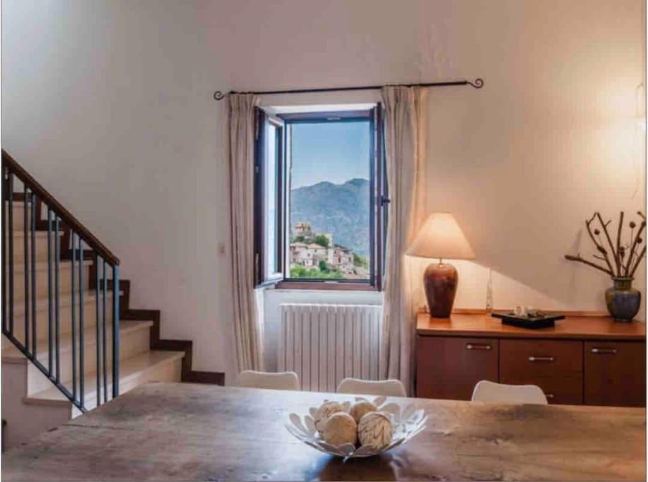 a dining room with a table and a window at TAORMINA - The Godfathers Little Mansion in Forza dʼAgro