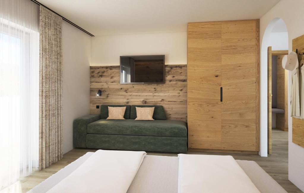Postel nebo postele na pokoji v ubytování Hotel Garni Feuerstein