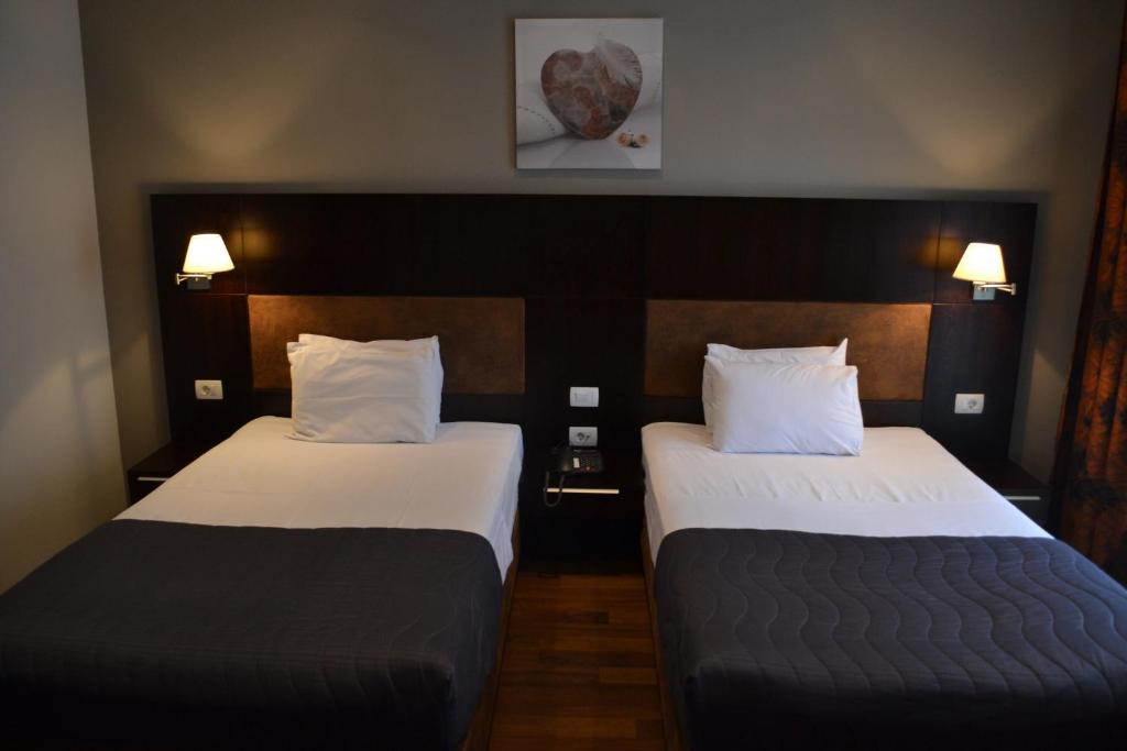 Postel nebo postele na pokoji v ubytování Hotel Dolce International