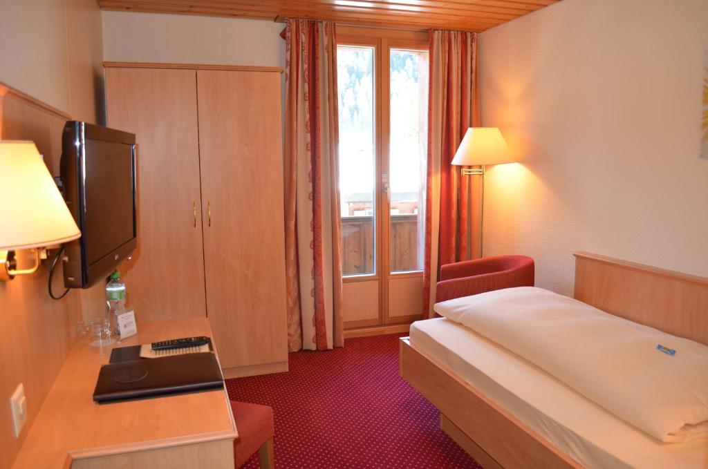 Voodi või voodid majutusasutuse Bernerhof Swiss Quality Hotel toas