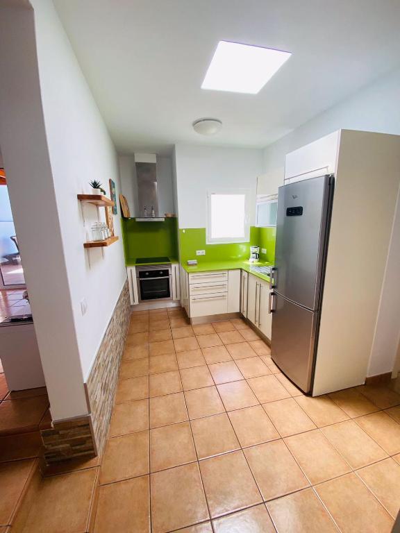 Kuchyň nebo kuchyňský kout v ubytování Vivienda Vacacional Naia