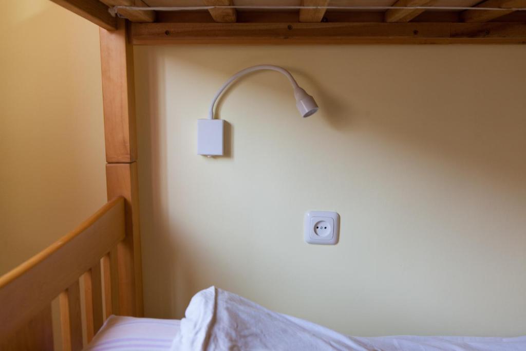 Postel nebo postele na pokoji v ubytování Center Hostel and Tours