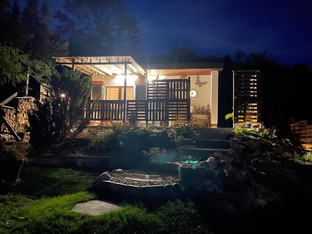 a garden at night with a house in the background at Haus Gisela in Thale