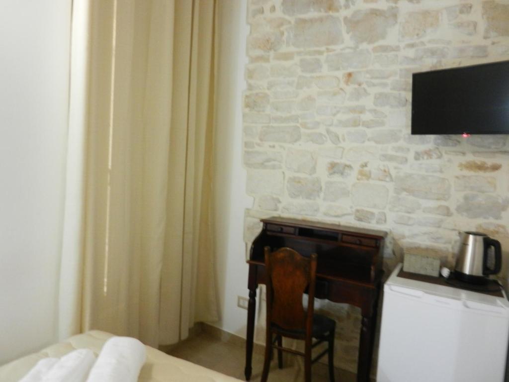 Telewizja i/lub zestaw kina domowego w obiekcie Antico Monastero
