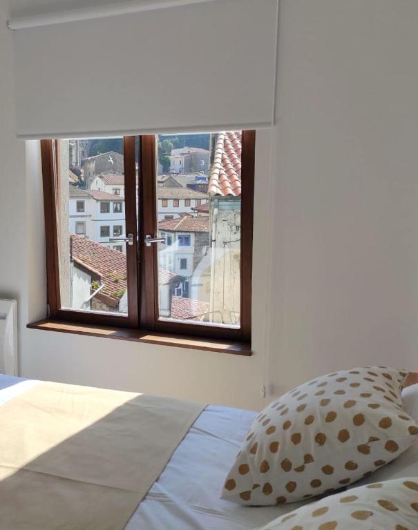 Postel nebo postele na pokoji v ubytování Apartamentos la Garita - El Taller - Cudillero