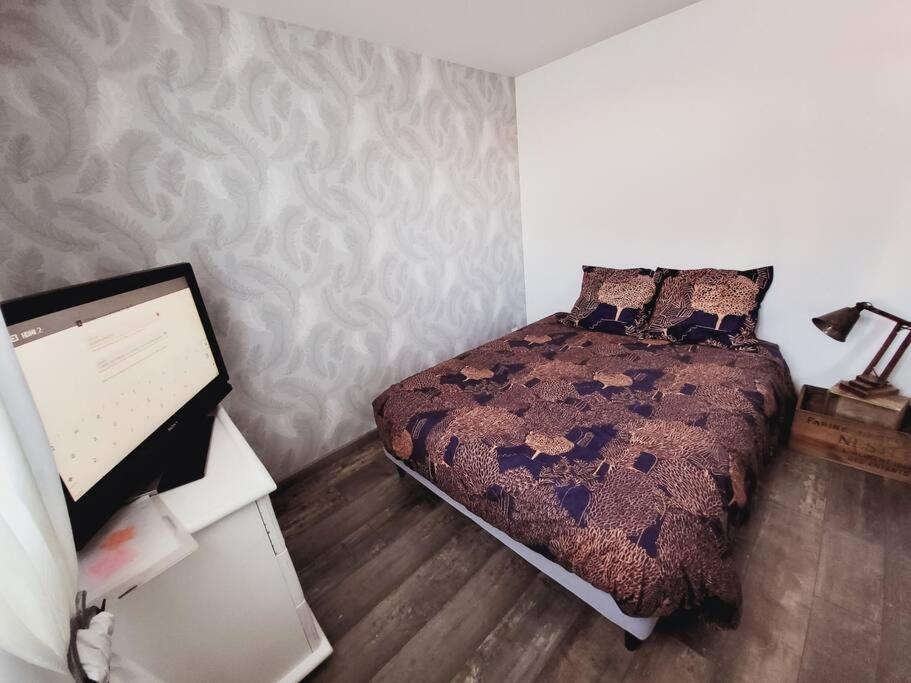 Postel nebo postele na pokoji v ubytování Studio tout confort