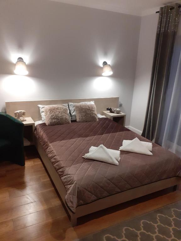 Postel nebo postele na pokoji v ubytování VILLA EDEN USTKA wypoczynek dla dorosłych