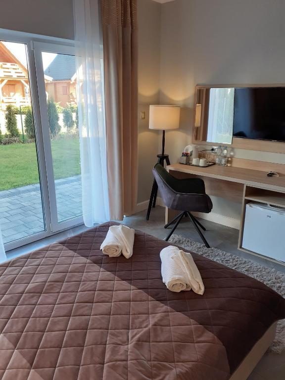 Postel nebo postele na pokoji v ubytování VILLA EDEN USTKA wypoczynek dla dorosłych