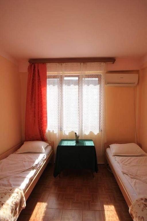 Postel nebo postele na pokoji v ubytování Center Hostel and Tours