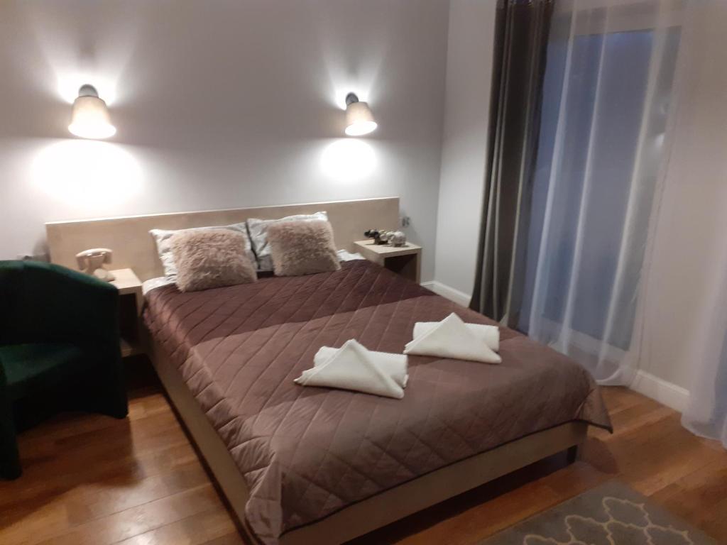 Postel nebo postele na pokoji v ubytování VILLA EDEN USTKA wypoczynek dla dorosłych