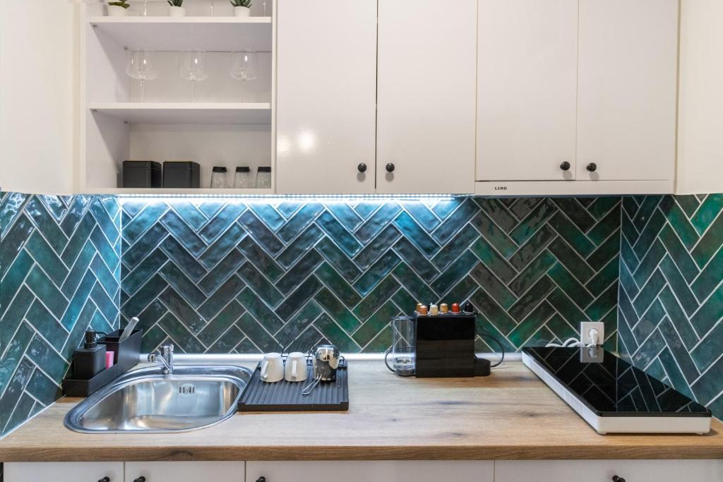 Kuchyň nebo kuchyňský kout v ubytování Harmony apartman