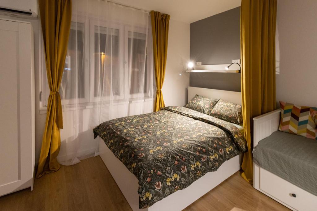 Postel nebo postele na pokoji v ubytování Harmony apartman