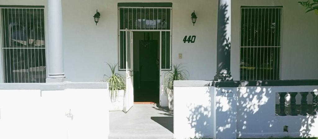 a front door of a house with a green door at 440 on Main in Paarl