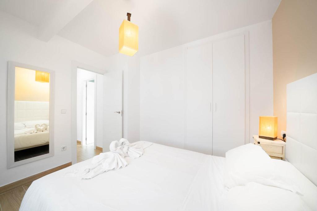 Posteľ alebo postele v izbe v ubytovaní Ático La Barca by Paradise Gold Rentals