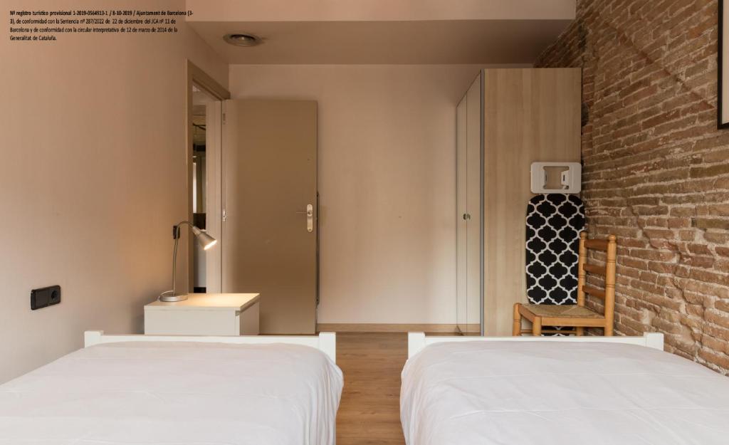Postel nebo postele na pokoji v ubytování Barnapartments Raval