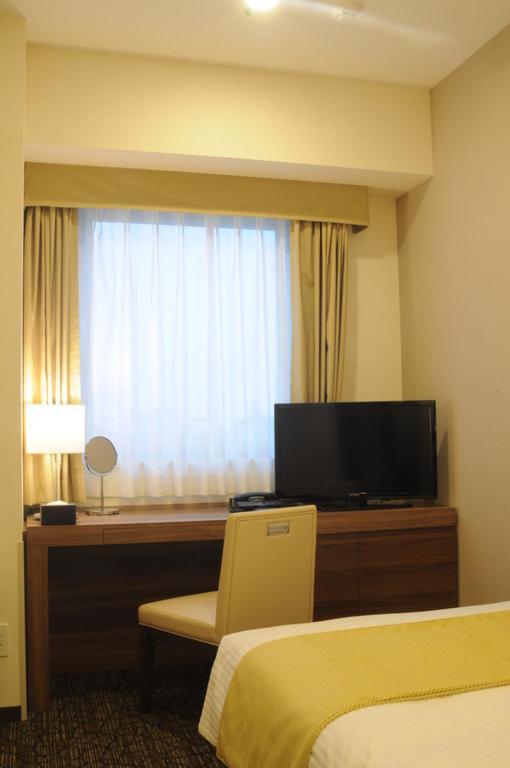 TV a/nebo společenská místnost v ubytování Hotel Sunroute Kumagaya Station