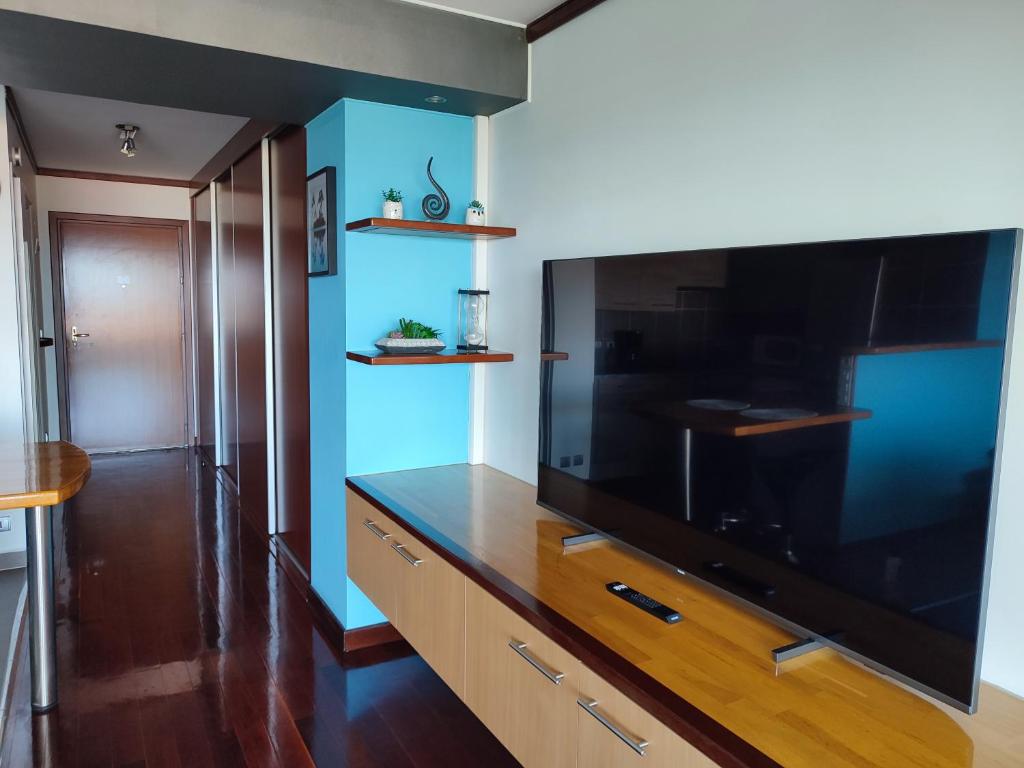 TV o dispositivi per l'intrattenimento presso Blue Moana Studio Papeete - Sea View, AC, Fast Wifi, Pool, Gym