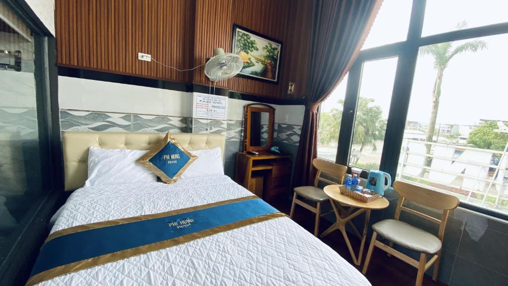 Postel nebo postele na pokoji v ubytování Hotel Phi Hùng