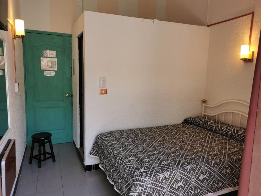 Postel nebo postele na pokoji v ubytování HOTEL LIMÓN