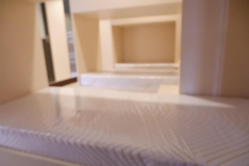 Postel nebo postele na pokoji v ubytování FB Budgetel Suites