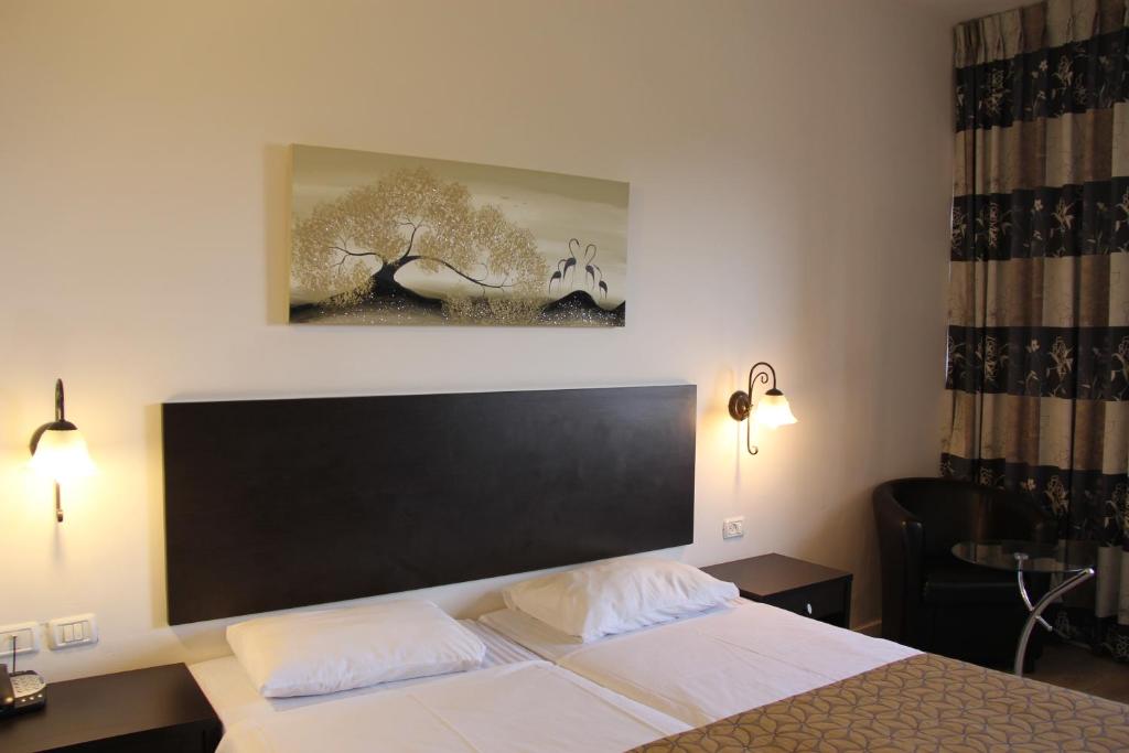 Postel nebo postele na pokoji v ubytování Restal Hotel