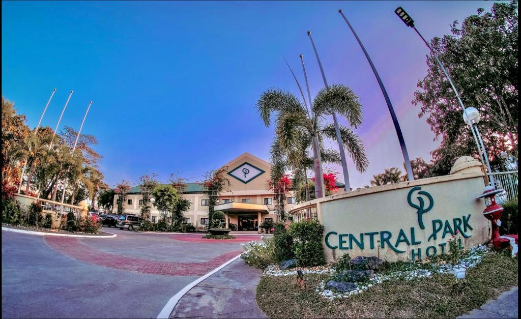 a central park hotel sign in front of a building at Luisita Central Park Hotel in Tarlac