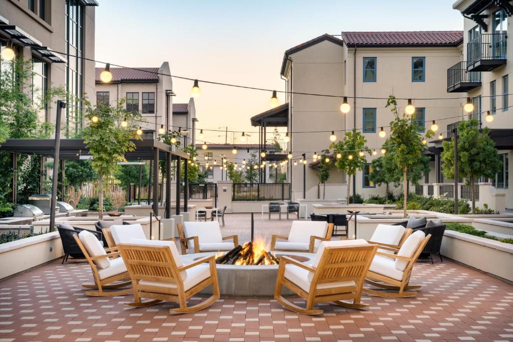 a patio with chairs and a fire pit at Locale Menlo Park in Menlo Park
