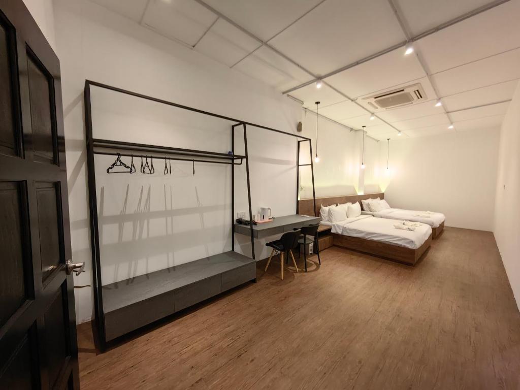 Postel nebo postele na pokoji v ubytování Kangsar Inn 73