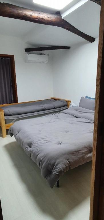 Voodi või voodid majutusasutuse Yachtie Inn Mokpo toas