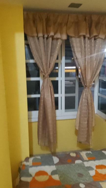 Postel nebo postele na pokoji v ubytování El Rincón del Ángel Tuxpan