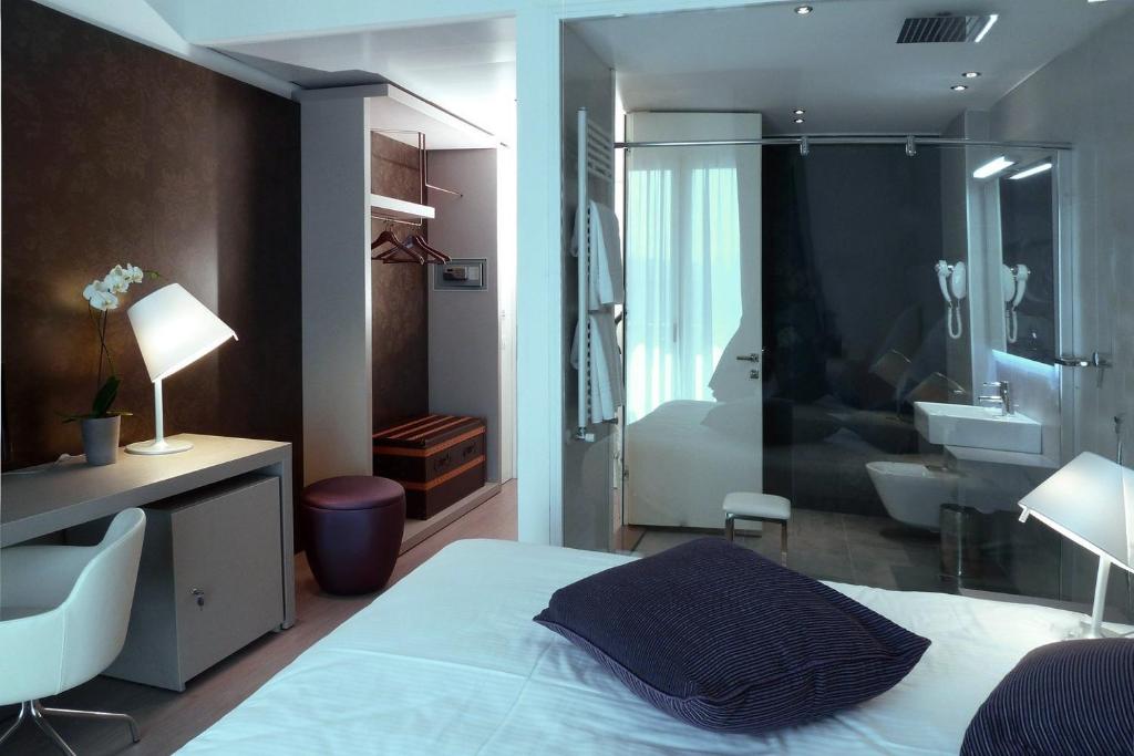Posteľ alebo postele v izbe v ubytovaní Hotel Lugano Torretta