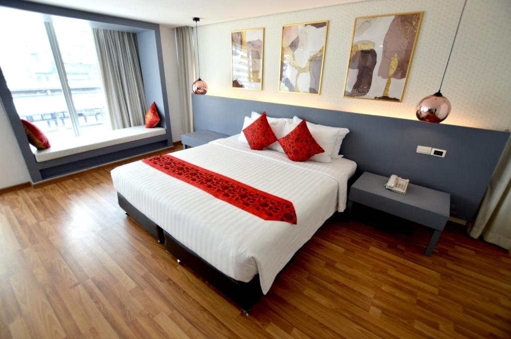 Postel nebo postele na pokoji v ubytování I Residence Hotel Silom
