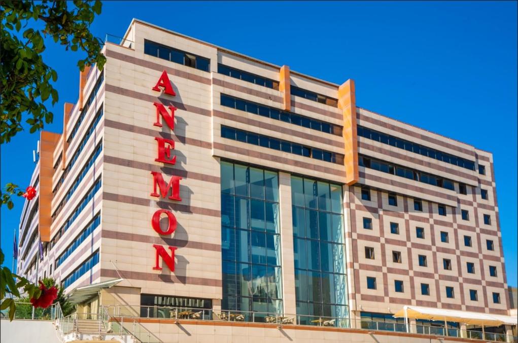a building with a sign on the side of it at Anemon Eskisehir Hotel in Eskisehir