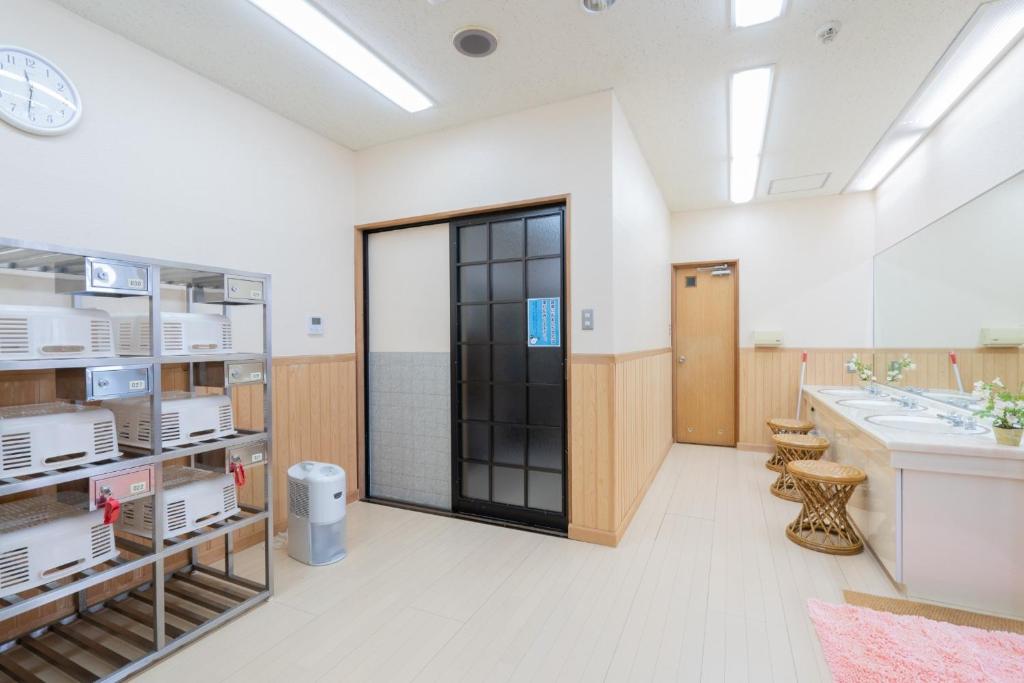a large bathroom with a sink and a large mirror at Angel Resort Yuzawa - Vacation STAY 10547 in Yuzawa