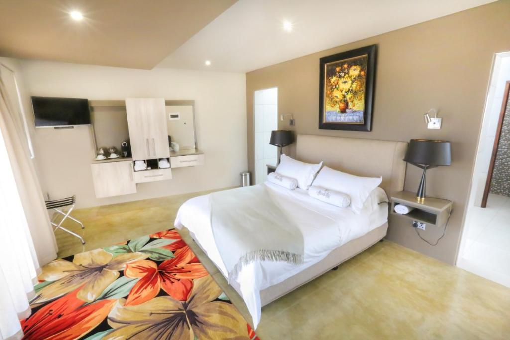 Ένα ή περισσότερα κρεβάτια σε δωμάτιο στο Thanda Tau