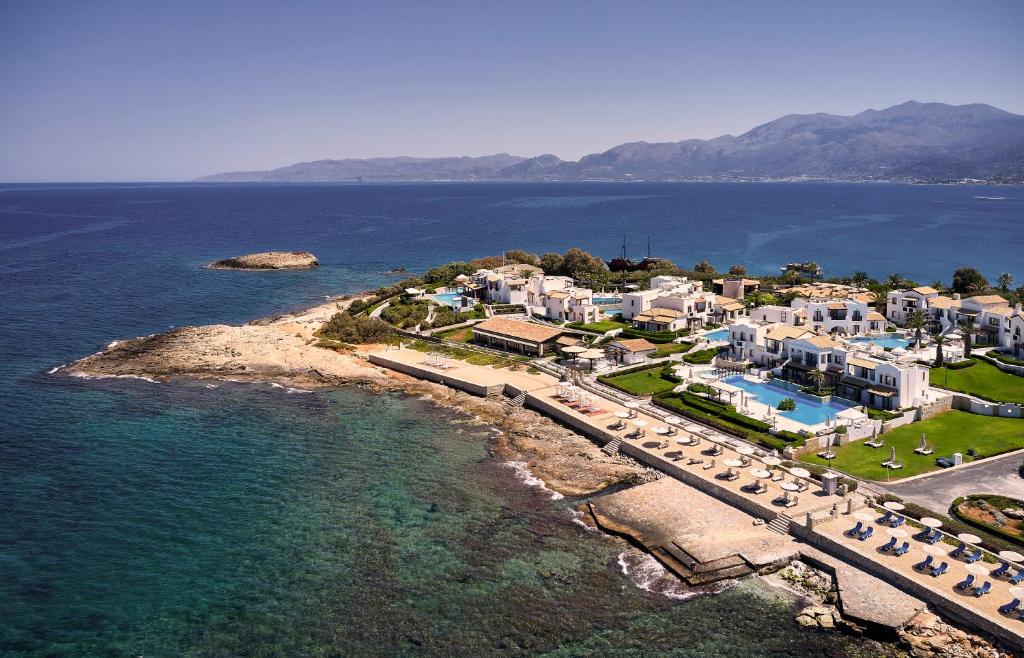 an aerial view of a resort and the ocean at Aldemar Knossos Royal in Hersonissos