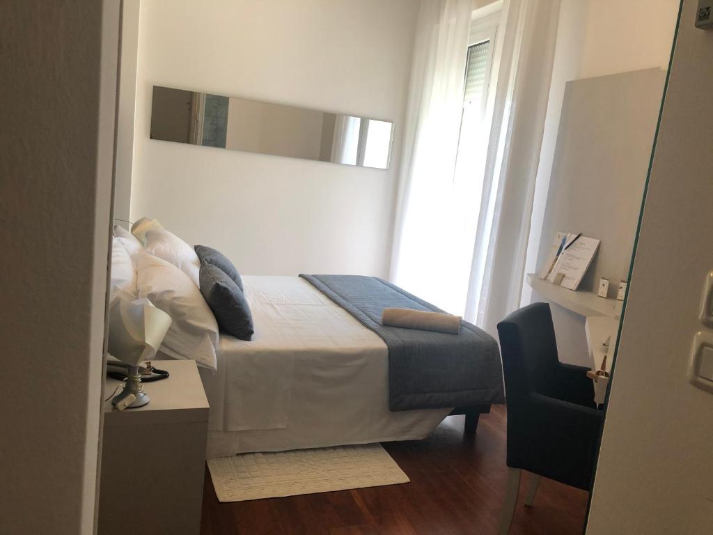 Postel nebo postele na pokoji v ubytování Hotel Alexander