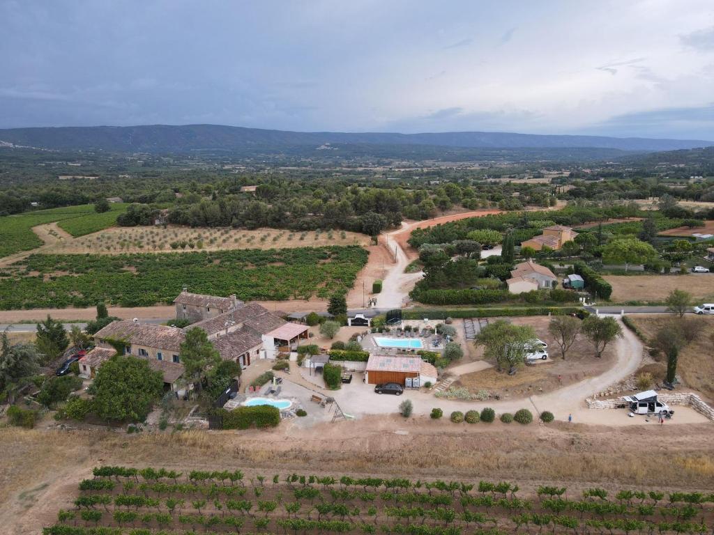 an aerial view of a farm with a road and a house at Gîte Coquelicot in Gargas