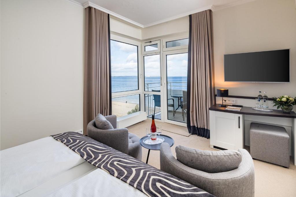 Postel nebo postele na pokoji v ubytování Hotel Bellevue
