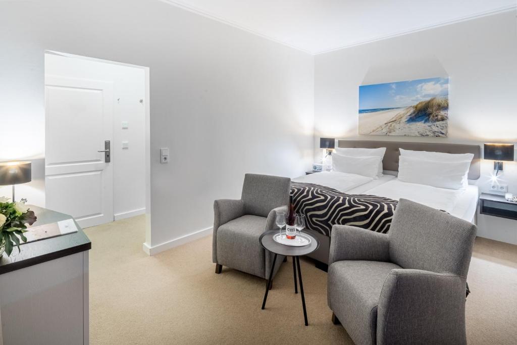 Postel nebo postele na pokoji v ubytování Hotel Bellevue