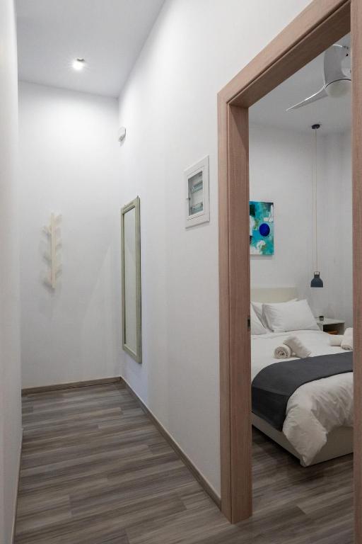 Postel nebo postele na pokoji v ubytování Central Suites Aegina 2