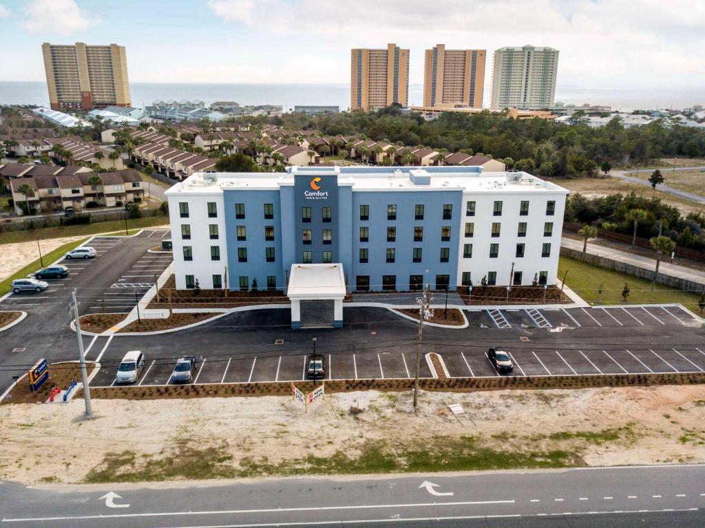 an aerial view of a building with a parking lot at Comfort Inn & Suites Panama City Beach - Pier Park Area in Panama City Beach