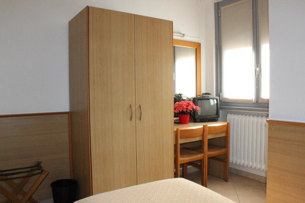 Postel nebo postele na pokoji v ubytování Hotel Milano
