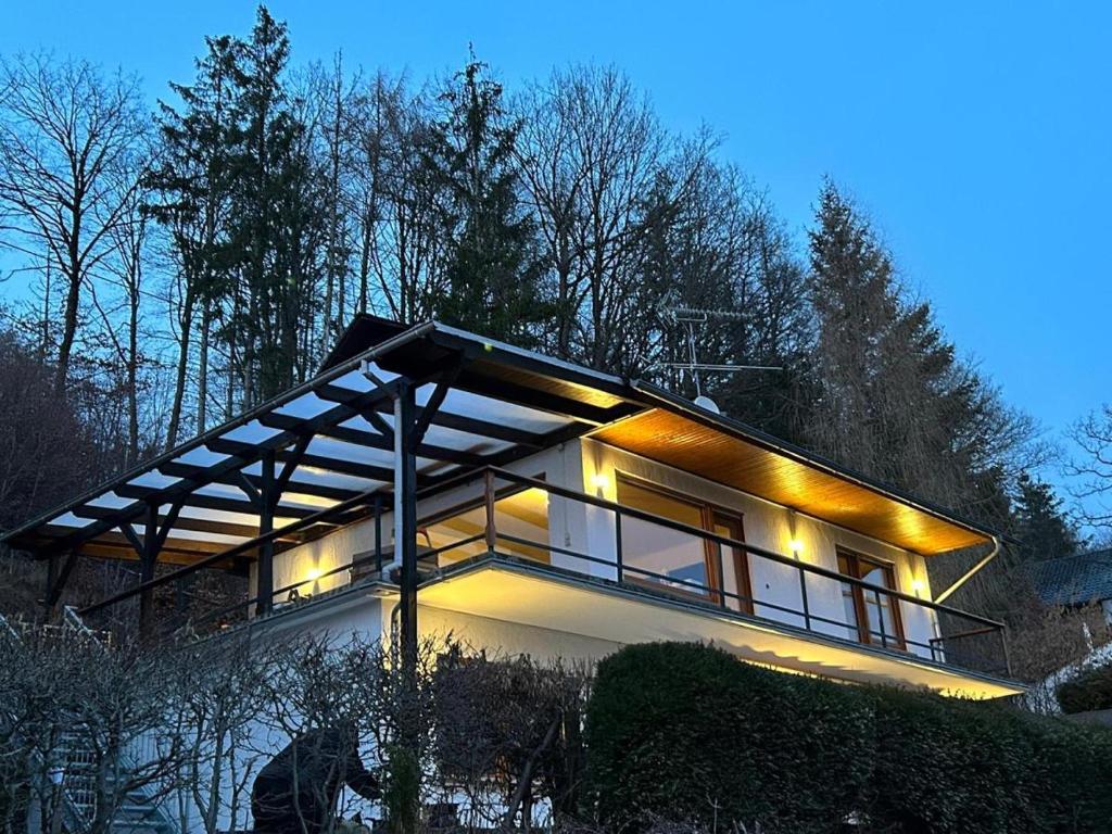 a house with lights on the side of it at GRETE - Haus Sonnenblick in Heringhausen