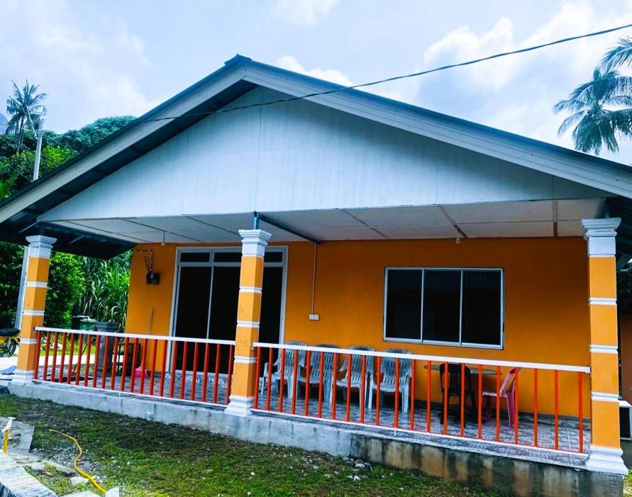 a small house with an orange at MUKUT CORAL CHALET in Tioman Island
