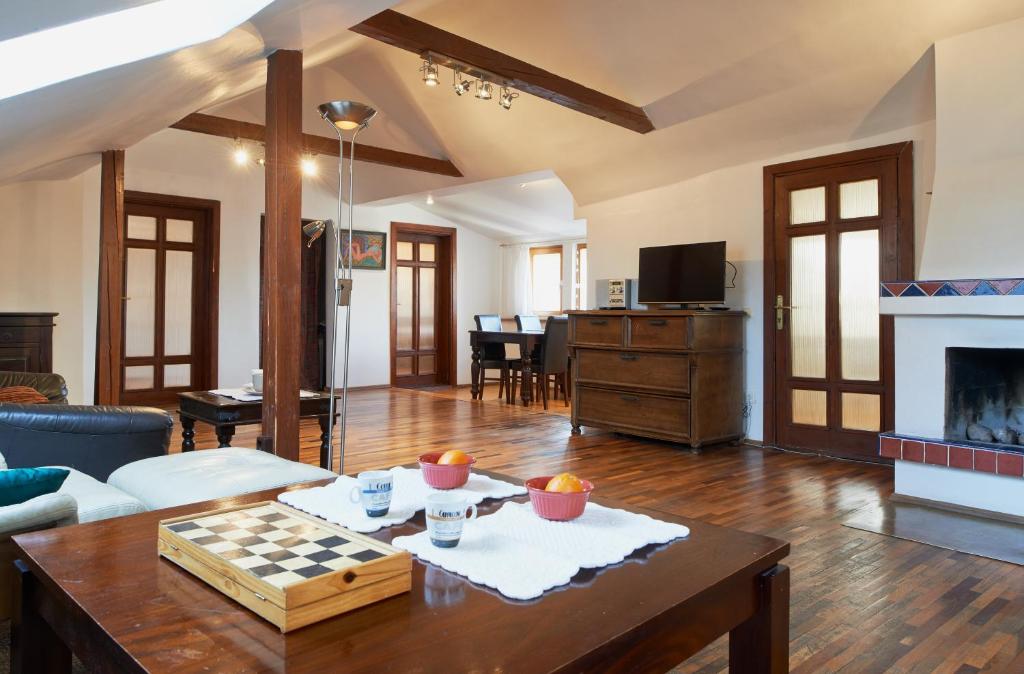 a living room with a chess board on a table at Regina House- sv. Mikalojaus 13 in Vilnius