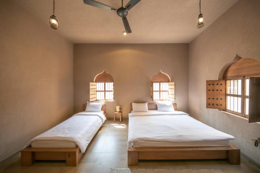 Postel nebo postele na pokoji v ubytování Alaqur View Inn نزل واجهة العقر